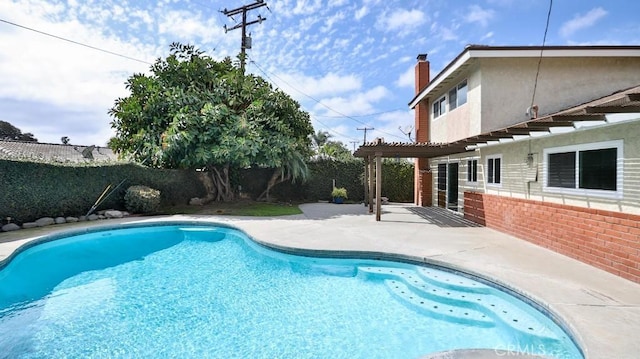 view of pool with a fenced in pool, a fenced backyard, a patio, and a pergola