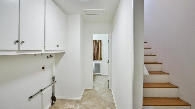 interior space featuring baseboards and visible vents