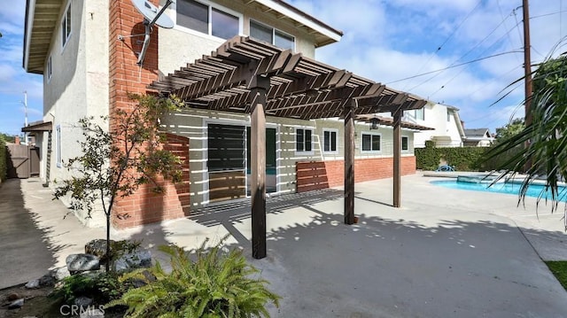 view of patio featuring fence, a fenced in pool, and a pergola