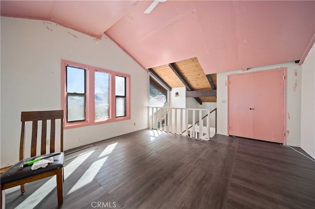 additional living space featuring vaulted ceiling with beams, wood ceiling, and wood finished floors