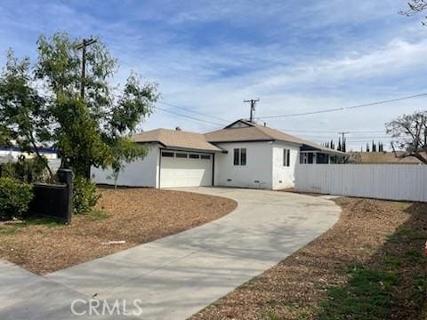 single story home featuring crawl space, fence, concrete driveway, and an attached garage