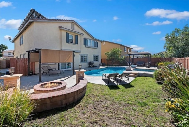 back of house featuring a patio area, a fenced backyard, and a pergola