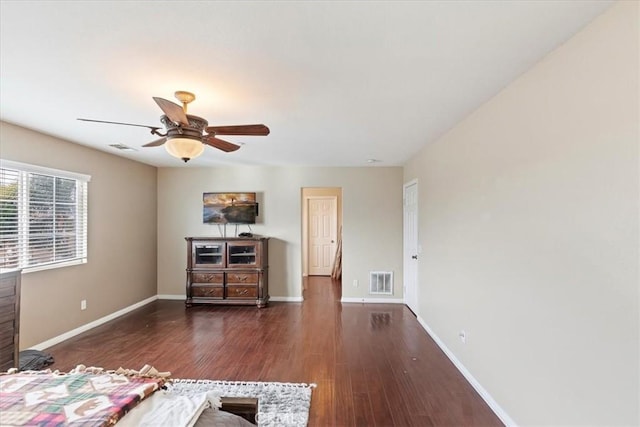 unfurnished bedroom featuring wood finished floors, visible vents, and baseboards