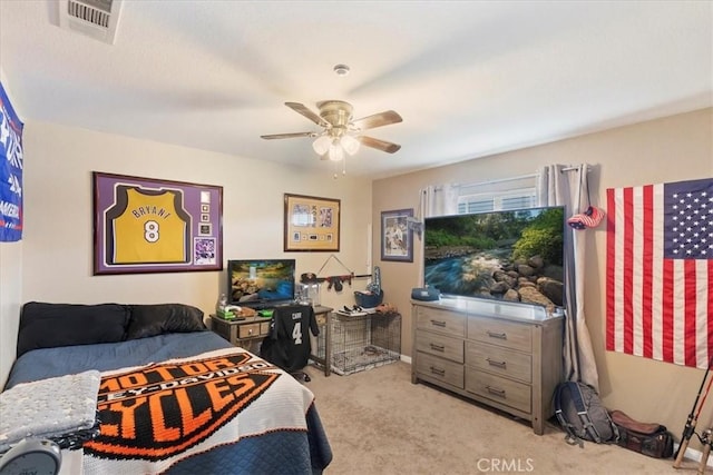 bedroom with ceiling fan, visible vents, and light colored carpet