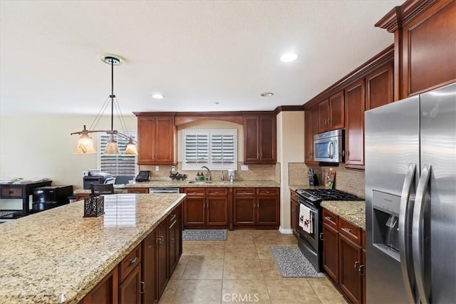 kitchen with light tile patterned floors, light stone counters, stainless steel appliances, a sink, and tasteful backsplash