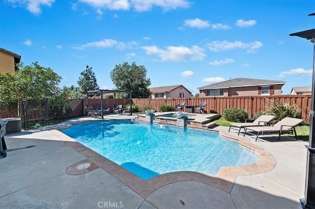 view of pool with an in ground hot tub, a patio area, a fenced backyard, and a fenced in pool