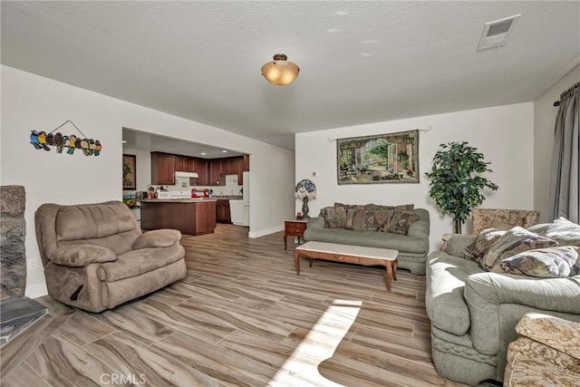 living area featuring visible vents