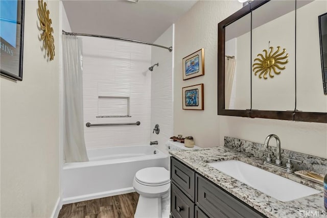 bathroom with toilet, shower / tub combo with curtain, wood finished floors, and vanity