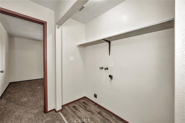 clothes washing area featuring laundry area, washer hookup, wood finished floors, baseboards, and electric dryer hookup