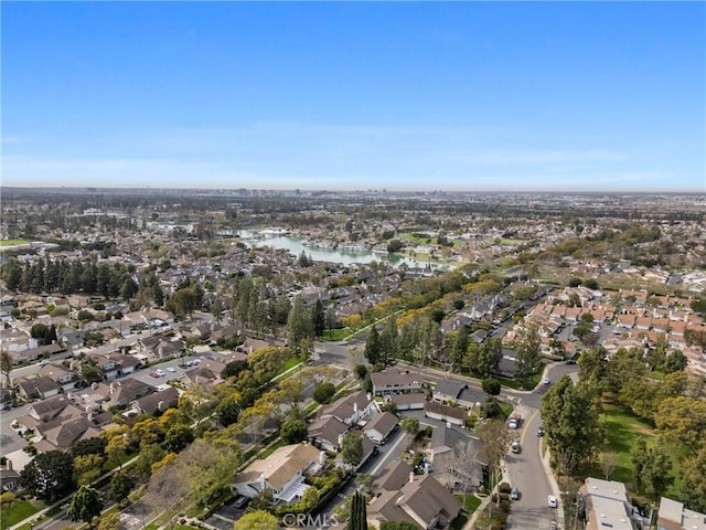 bird's eye view with a residential view and a water view