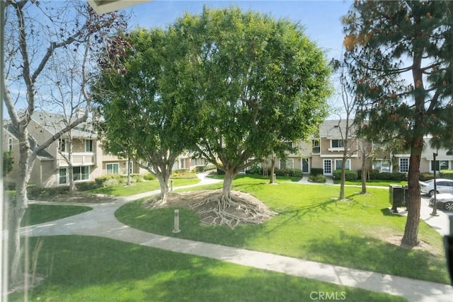 surrounding community featuring a residential view and a lawn