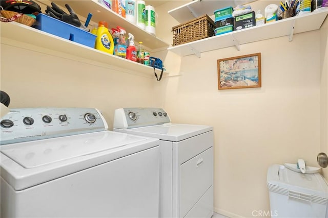 laundry area with laundry area and washer and clothes dryer