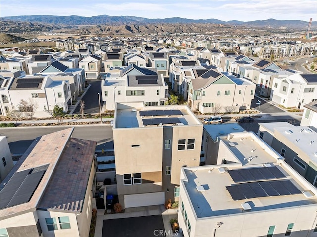 drone / aerial view with a residential view and a mountain view