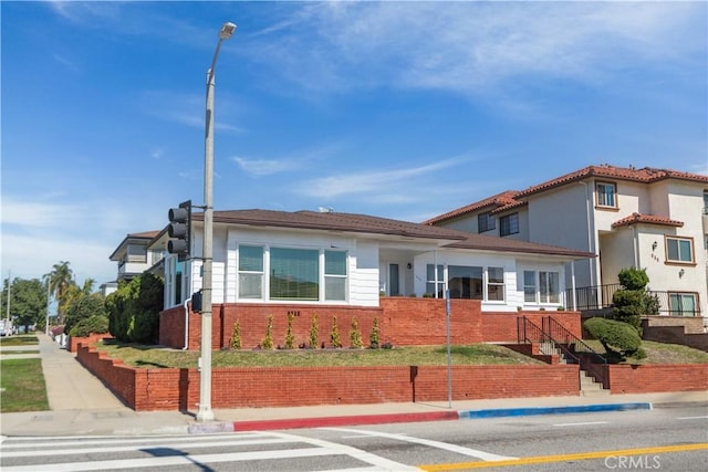 view of front of house with brick siding