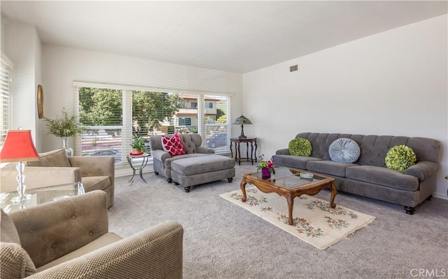 carpeted living room with visible vents