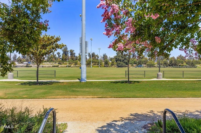 view of home's community with a lawn