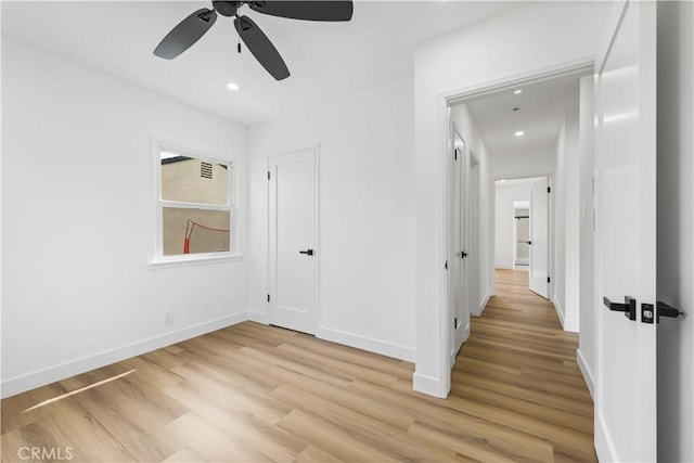 interior space featuring recessed lighting, light wood-style flooring, and baseboards