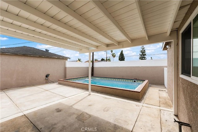 view of swimming pool with a patio area, a fenced backyard, and a fenced in pool