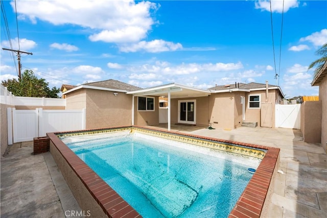 view of pool with a patio area, a fenced backyard, a gate, and a fenced in pool