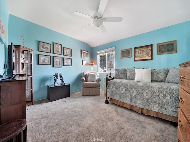 bedroom with a ceiling fan, carpet, and lofted ceiling