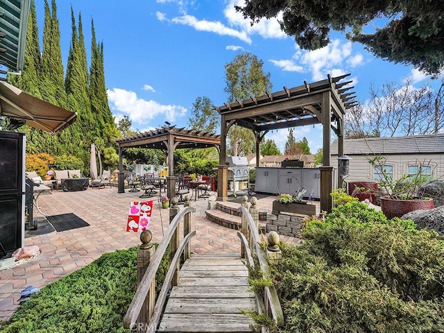 view of patio / terrace with a gazebo and an outdoor kitchen