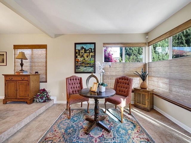 sitting room featuring light tile patterned floors and baseboards