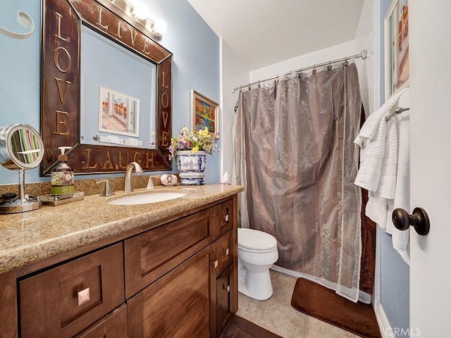 full bath with toilet, tile patterned floors, curtained shower, and vanity