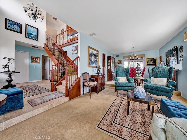 living room with stairs, light colored carpet, visible vents, and an inviting chandelier