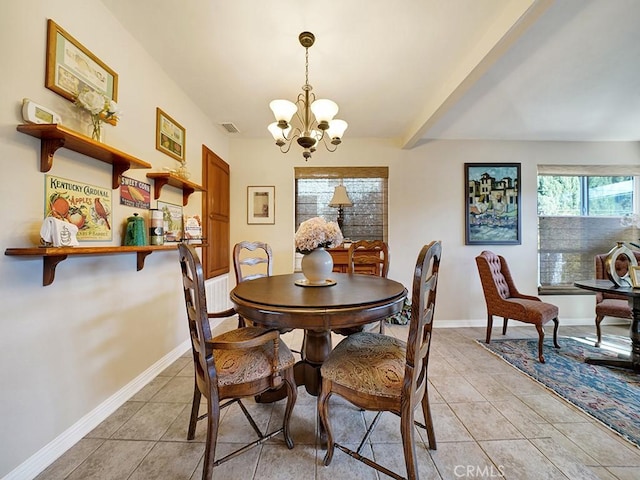 dining area with light tile patterned floors, baseboards, visible vents, and a notable chandelier