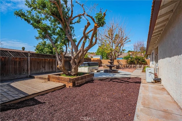 view of yard featuring ac unit, a patio area, and a fenced backyard