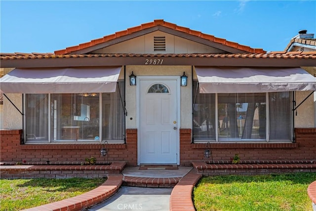 view of front of home with brick siding