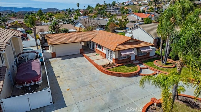 birds eye view of property featuring a mountain view and a residential view