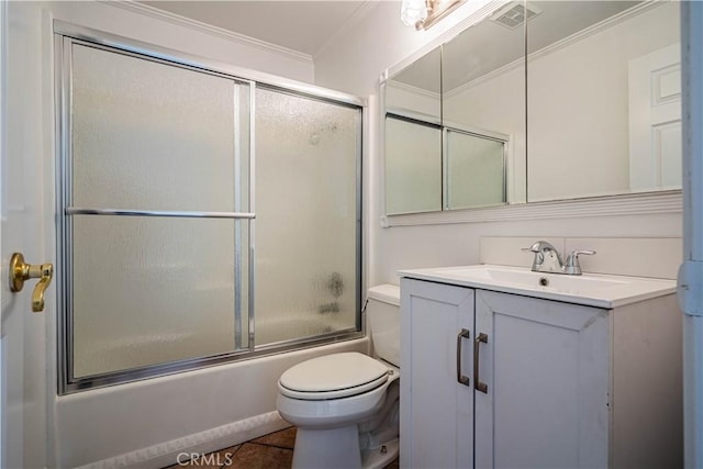 full bathroom featuring toilet, shower / bath combination with glass door, vanity, visible vents, and ornamental molding