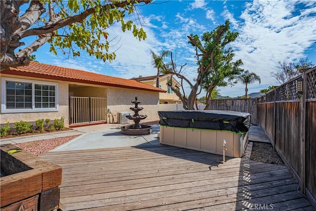 deck with central AC unit and a fenced backyard