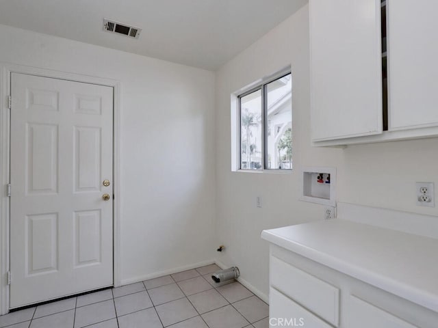 laundry room with cabinet space, light tile patterned floors, baseboards, visible vents, and hookup for a washing machine