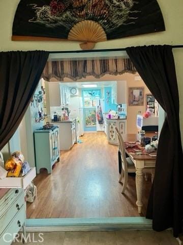 dining space with wood finished floors