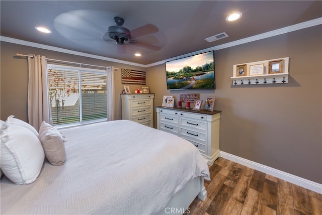 bedroom with dark wood-style flooring, visible vents, and crown molding