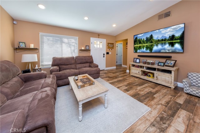 living room featuring recessed lighting, wood finished floors, visible vents, baseboards, and vaulted ceiling