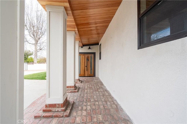 view of exterior entry with stucco siding