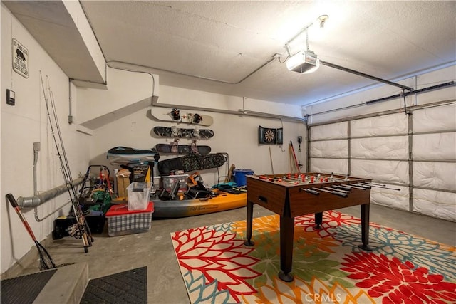 recreation room featuring a garage and unfinished concrete floors