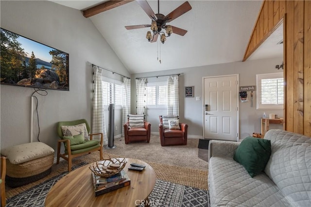 living area with lofted ceiling with beams, carpet flooring, a ceiling fan, and baseboards