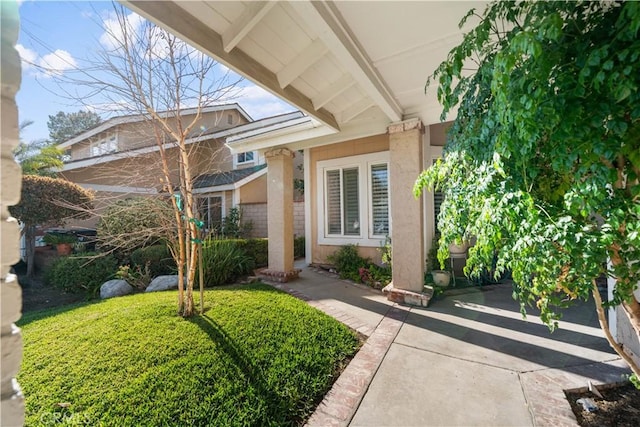 property entrance with stucco siding