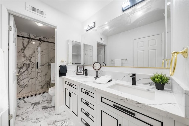 bathroom with marble finish floor, a marble finish shower, visible vents, toilet, and a sink