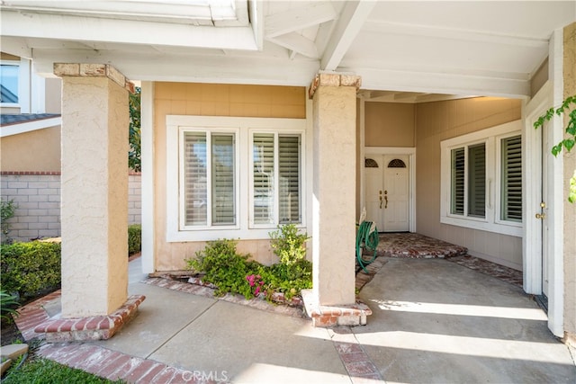 doorway to property with stucco siding