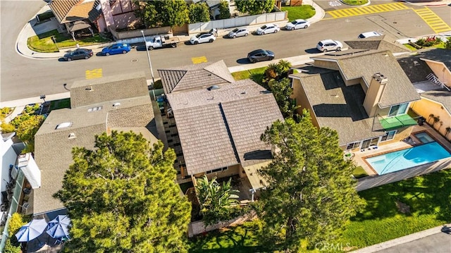 birds eye view of property with a residential view