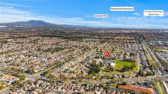 birds eye view of property with a residential view and a mountain view