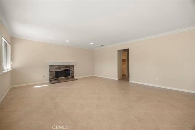 unfurnished living room with light tile patterned floors, a fireplace, baseboards, and crown molding