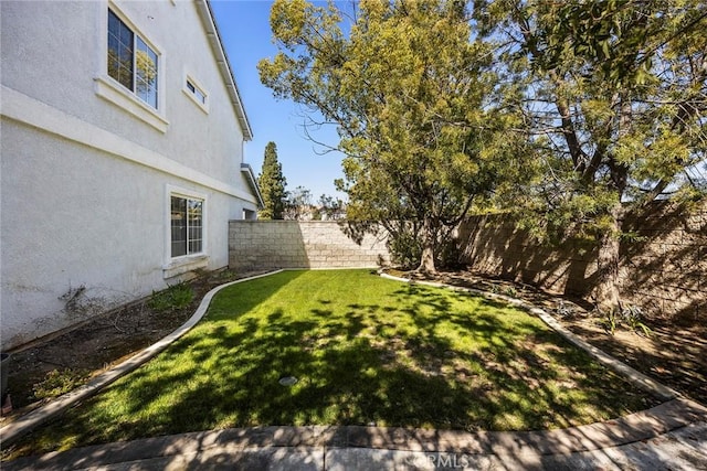 view of yard featuring a fenced backyard