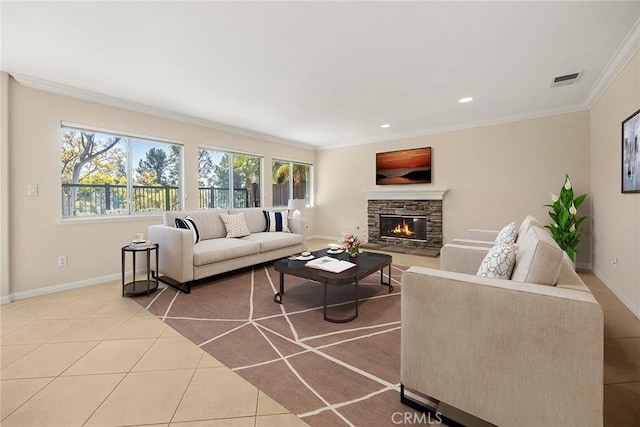 tiled living area with baseboards, a fireplace, visible vents, and crown molding