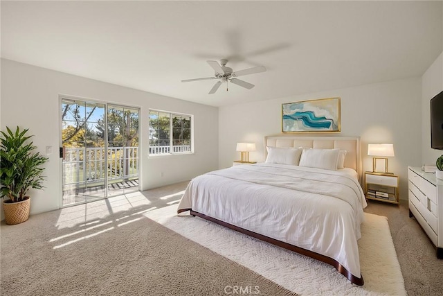 carpeted bedroom featuring ceiling fan and access to exterior